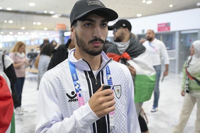 Palestinian boxer Abusal wears shirt with theme of Israel's Gaza attacks at opening of Olympics