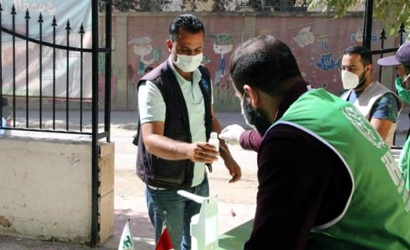 İHH, Afrin'de 10 bin maske  ve el dezenfektanı dağıttı