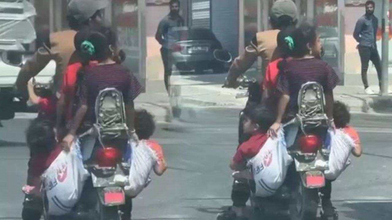 6 kişinin bindiği motosiklette çocuklar çuvalla taşındı