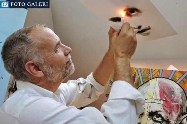 Ateşle resim çiziyor!