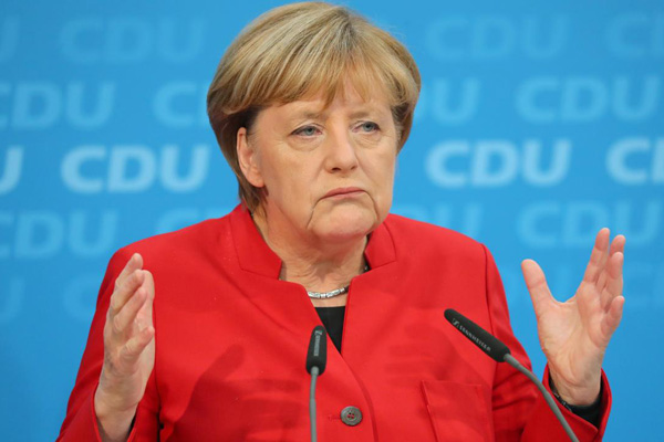 Merkel'in partisi yüzde 9 gerileyerek iktidara geldi
